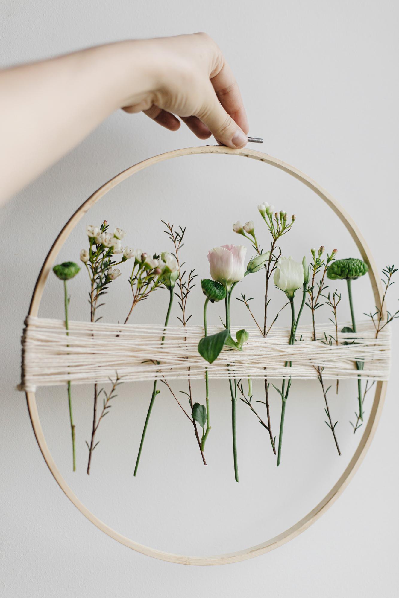 Hoop with delicate floral embroidery on linen